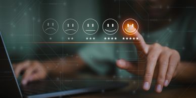 Person selecting a five-star rating on a digital feedback interface.