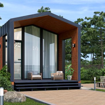 Modern tiny house with large glass windows and a wooden deck.