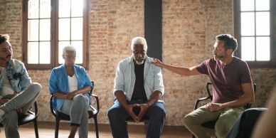 Group therapy session with emotional support.