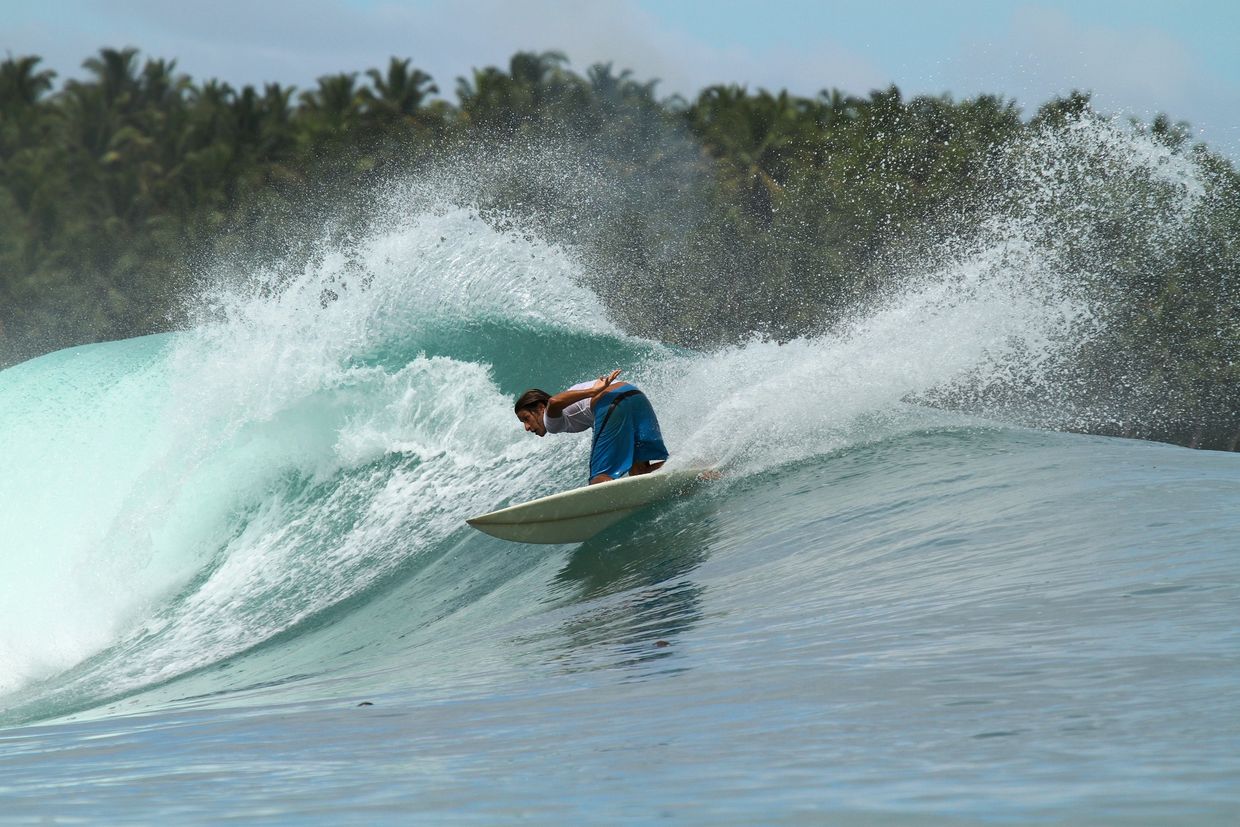A Mentawai Surfer cutting back on a wave.