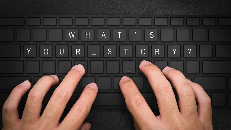 what's your  story.Hand typing on desktop office computer keyboard. script writer or filmmaker typing on a computer or laptop keyboard. Business workplace.