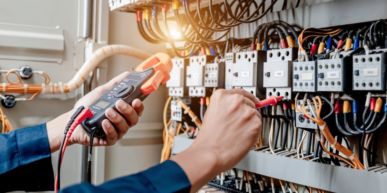 Technician testing the source of an electrical problem
