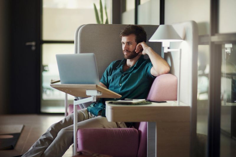 Laptop, remote work reading and business man at a worker productivity center working. Web design, internet analytics and businessman typing an email with technology at a desk planning a online job