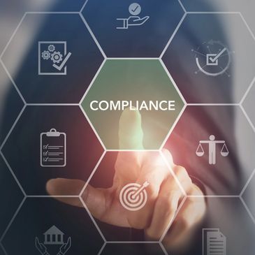 Businessman selecting compliance icon on virtual interface.