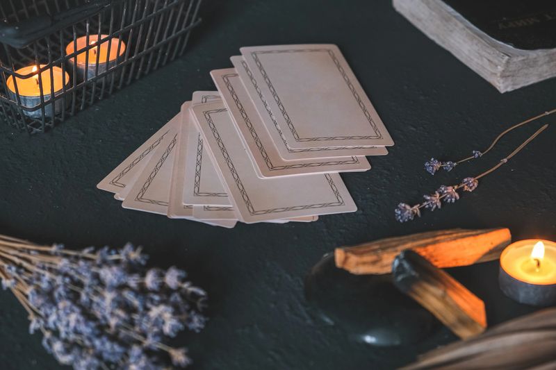 Esoteric, Occult mystical ritual scene of sorcery tarot candles, dried flowers, palo santo and tarot cards, ritual book. Witchcraft, mysticism and occultism,esoteric background