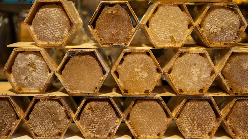 Organic honey in hexagonal honeycombs