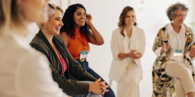 Group of women engaged in a lively discussion.