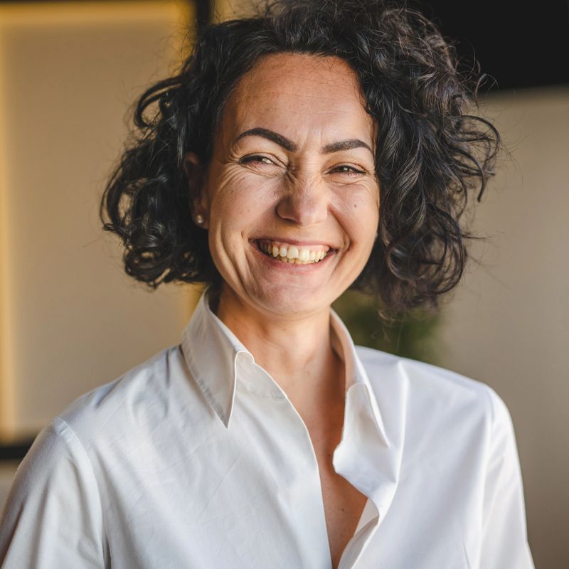Mature caucasian woman wear white shirt happy smile portrait close up