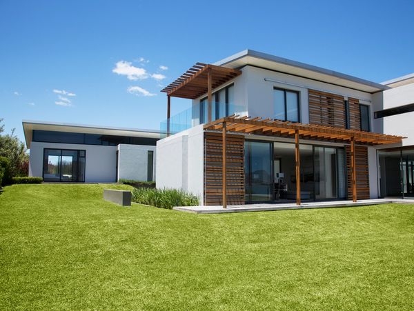 Modern house with green lawn.