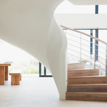 Modern interior with a wooden curved staircase - we can paint it all