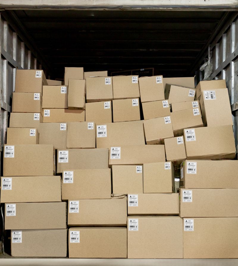 Merchandise packed in boxes in the back of a truck at a commercial dock -freight transportation concepts