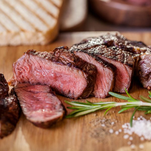 Strip loin steak cut up on a board
