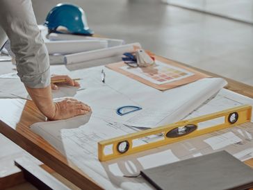 A man draws the structure of construction side