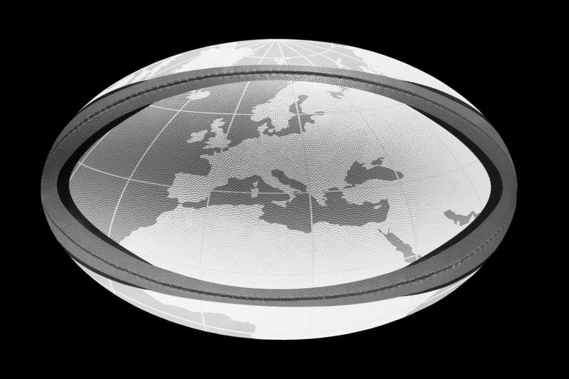 Rugby ball with a world map drawn on it.