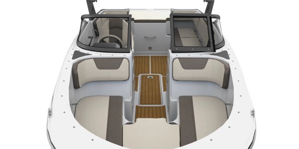 Top-down view of a modern boat interior with seating and steering.