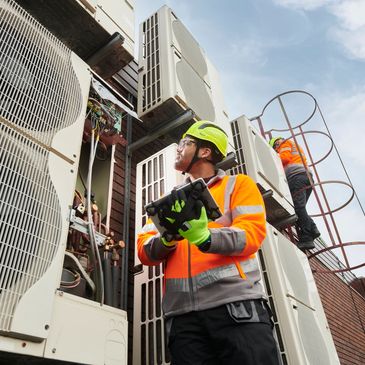 A picturesque landscape featuring mountains, a clear blue sky, and a serene lake reflecting the scenery.
