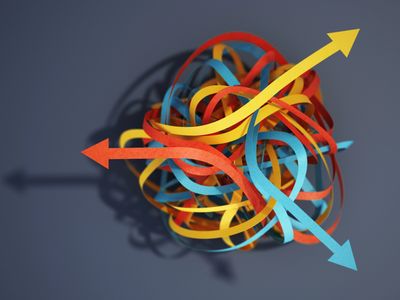 Colored twisted paper arrows tangled together.