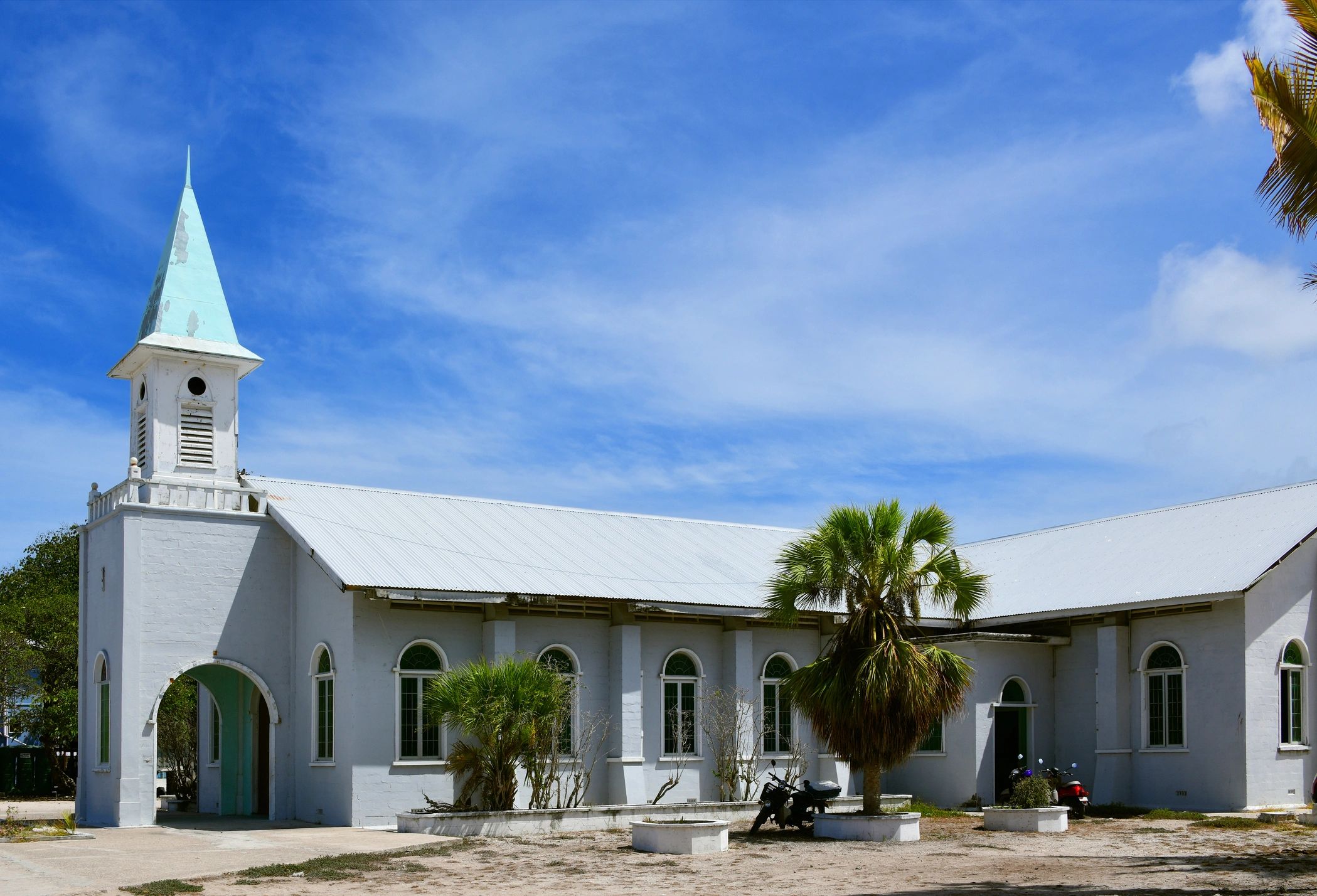 Friendly pastor with congregation outside the church.
