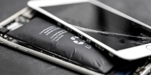 Swollen lithium-ion battery inside a disassembled smartphone.