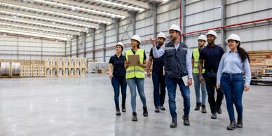 Group of engineers inspecting a warehouse.