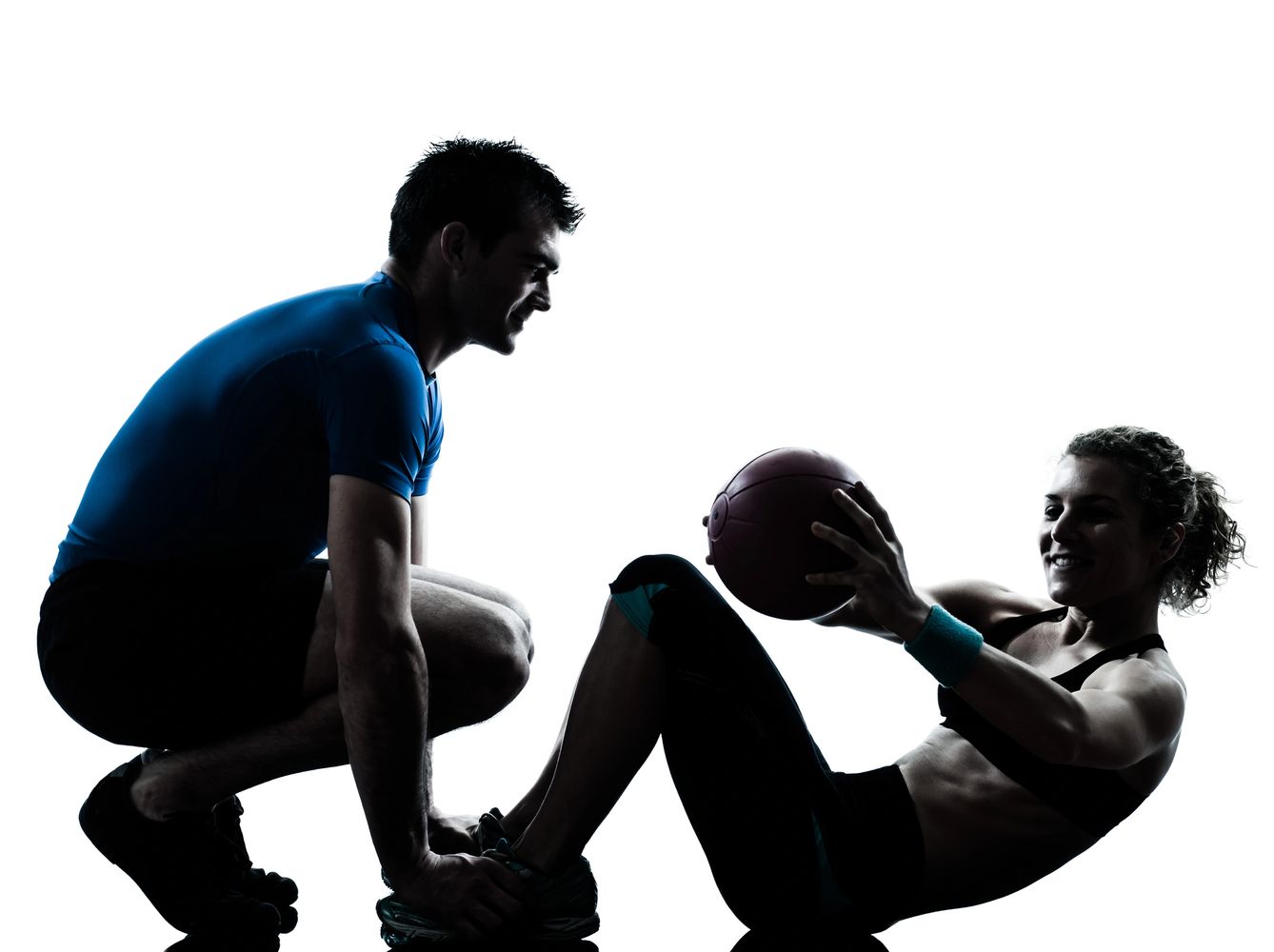 Trainer coaching client at Raw Fitness gym — strength training with accountability support.