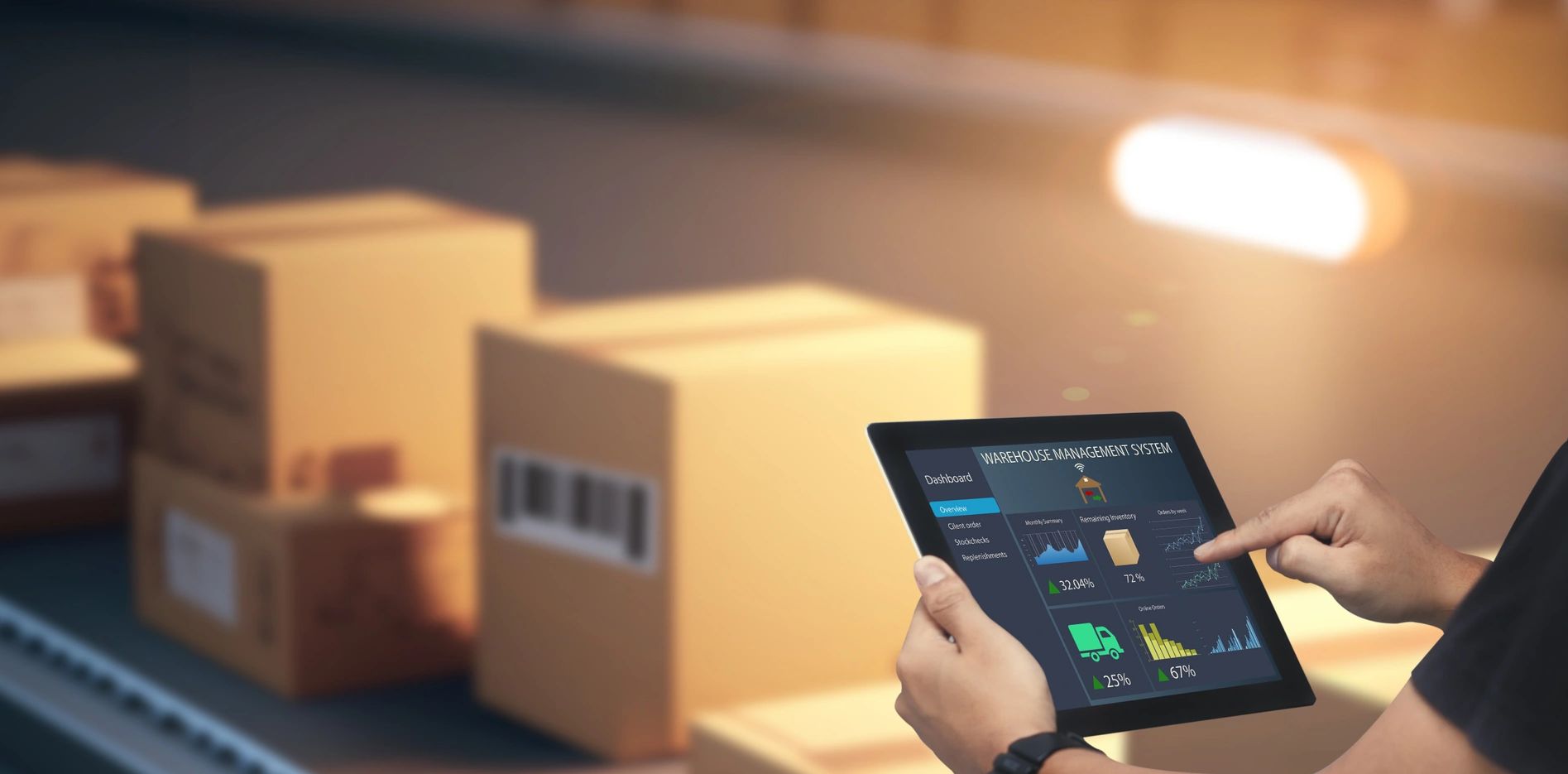 packages and a person touching a tablet