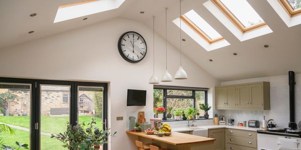 Bright modern kitchen with garden view and central island.