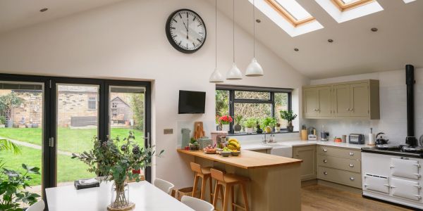 Bright modern kitchen with garden view and central island.