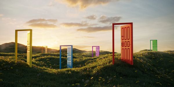 a nice rolling hillside, sun setting, with 5 beautifully painted door ways.