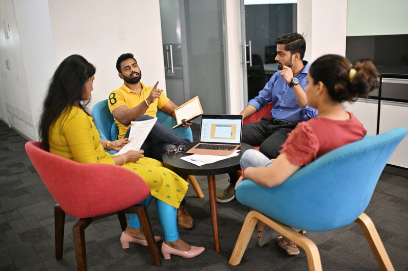 Team members in a pre-event planning meeting sharing insights and ideas