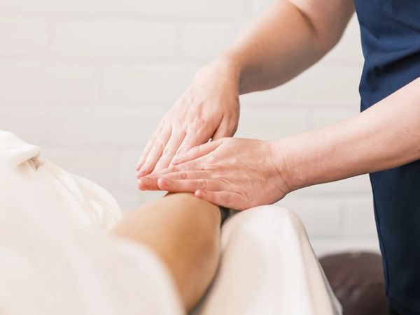 Massage therapist providing light oncology massage therapy at Wholly Spirit Hands Sugar Land.