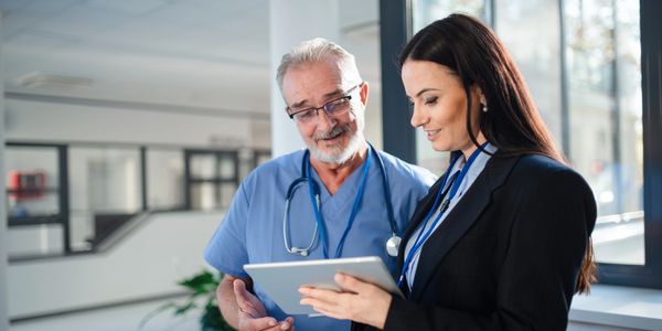 Admin and medical personnel working together. Shows how Medical HR works with medical staff.