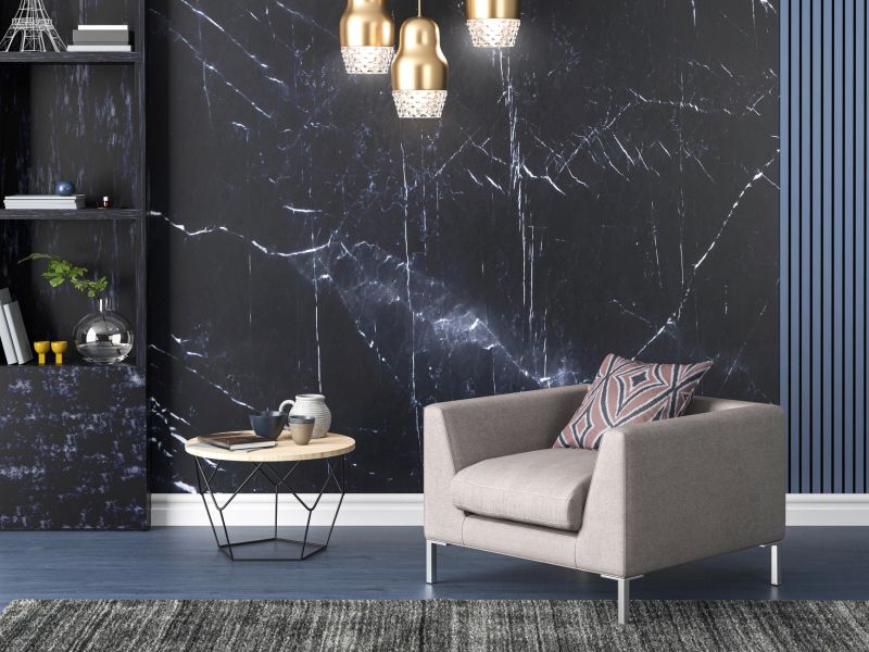 A finished living room with a feature wall covering behind the seating