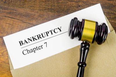 Bankruptcy Chapter 7 document with a judge's gavel on a wooden table.