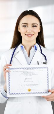 Female doctor holding a medical certificate.