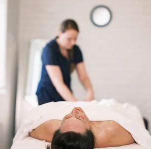 Therapist performing pain relief techniques.