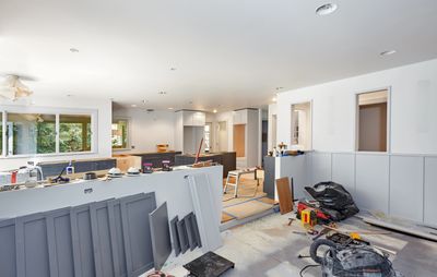 Modern minimalist interior remodel with a neutral color palette and kitchen cabinets in Boca Raton