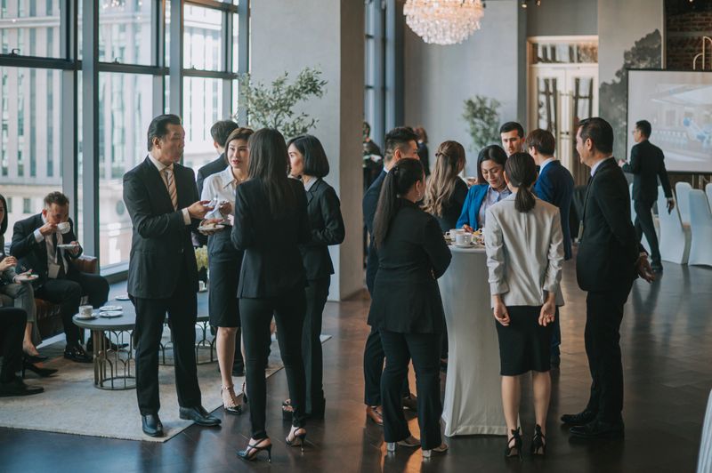 Asian Multiethnic business people talk during a coffee break in Seminar Business conference