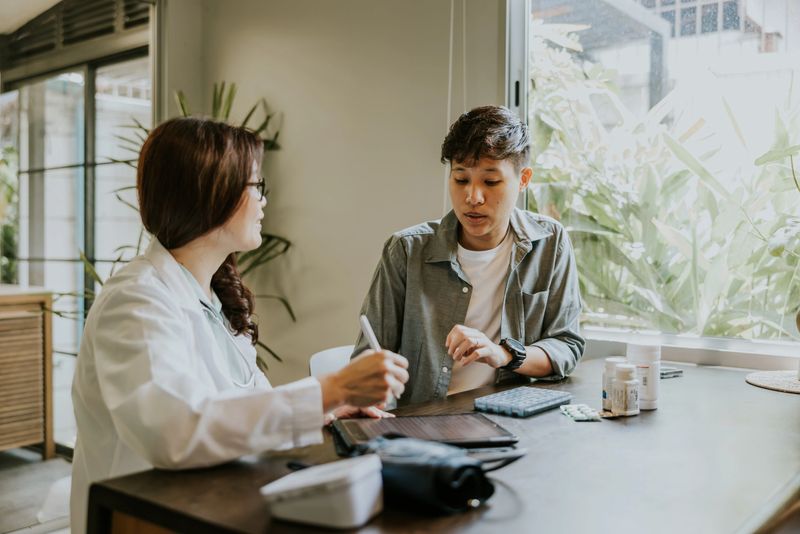 Asian female psychiatrist giving advice and suggestion about hormones medicine for transgender person before getting a gender affirmation surgery-female to male.