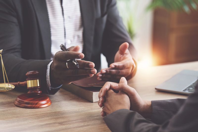 American African Lawyers advice to client about agreement contract. Law, legal services, advice, Justice concept.