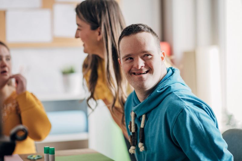 Disability health care art workshop.Down syndrome people  doing an art project
