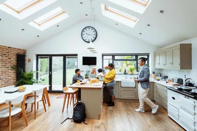 Mixed race family at home. Mixed race African-Asian woman and Korean or Pan-Asian man with kids at home. Real family.