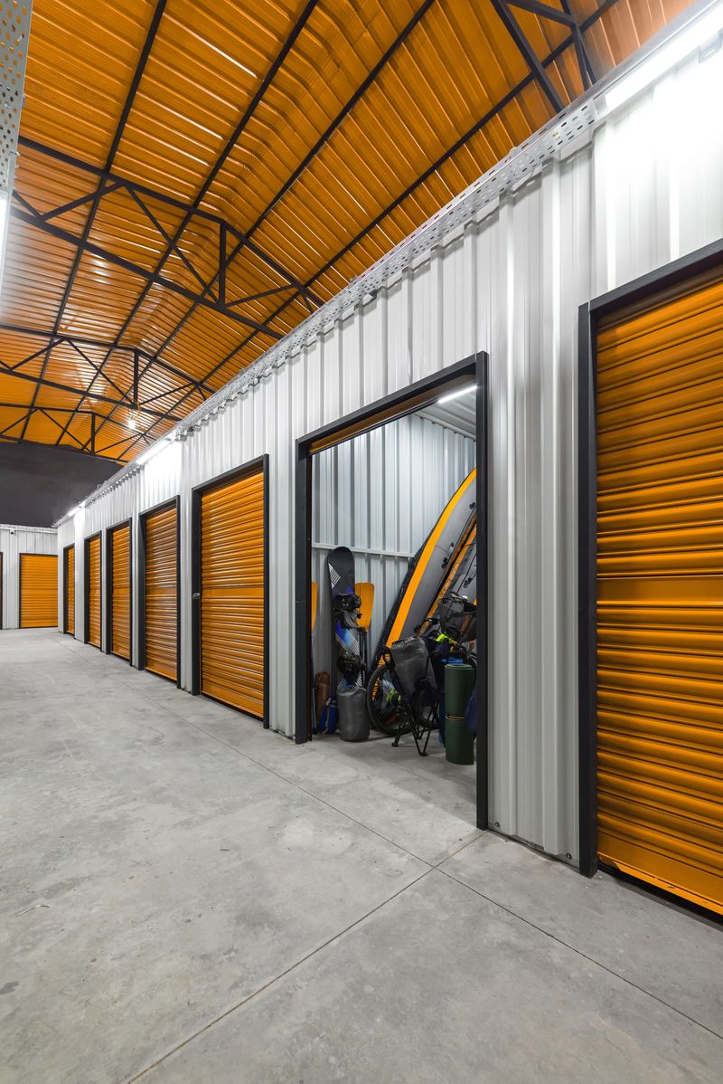 Corridor of self storage unit with yellow doors. Rental Storage Units