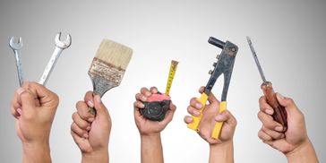 Paint brushes and tools representing handyman services by Sunny Days Lawn Care LLC in Kalamazoo