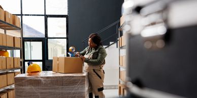 Client performing a job task is observed by occupational therapy, representing job demands analysis