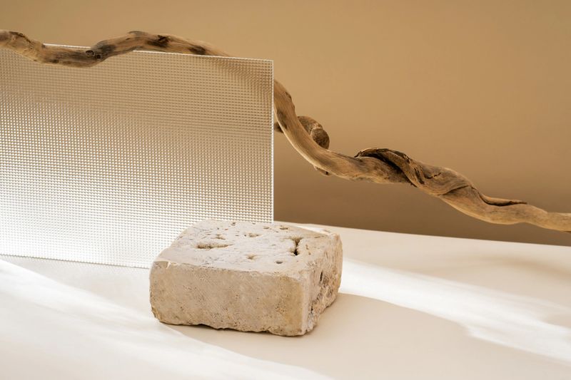 Composition empty podium material wood and glass geometric shape. Pastel beige background. Beautiful background made of natural materials for product presentation