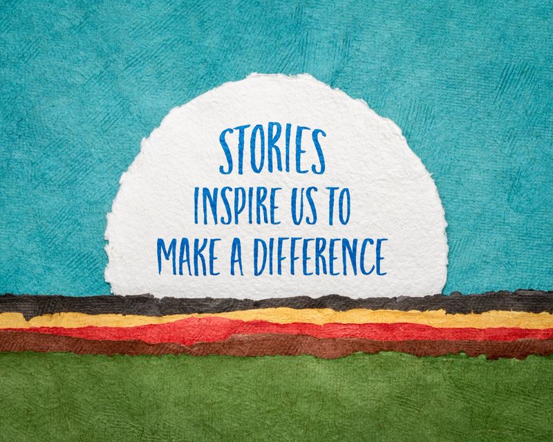 stories inspire us to make a difference - inspirational handwriting on a circular sheet of watercolor paper against abstract landscape with rising sun, storytelling, inspiration and communication concept