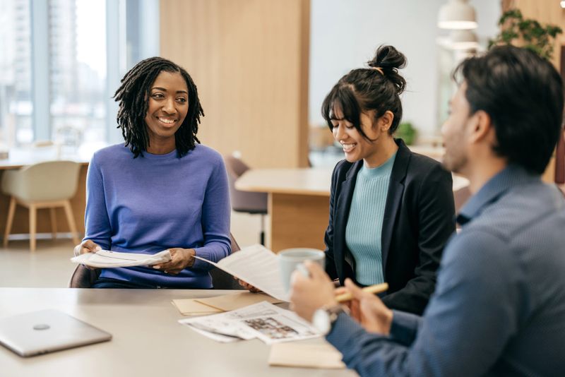 A group of young people in a business meeting. - stock photo