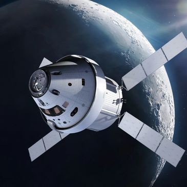 A spacecraft orbiting near the Moon with solar panels extended.