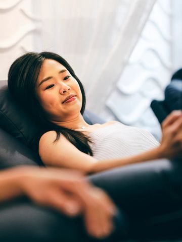 Woman relaxing on a recliner indoors.